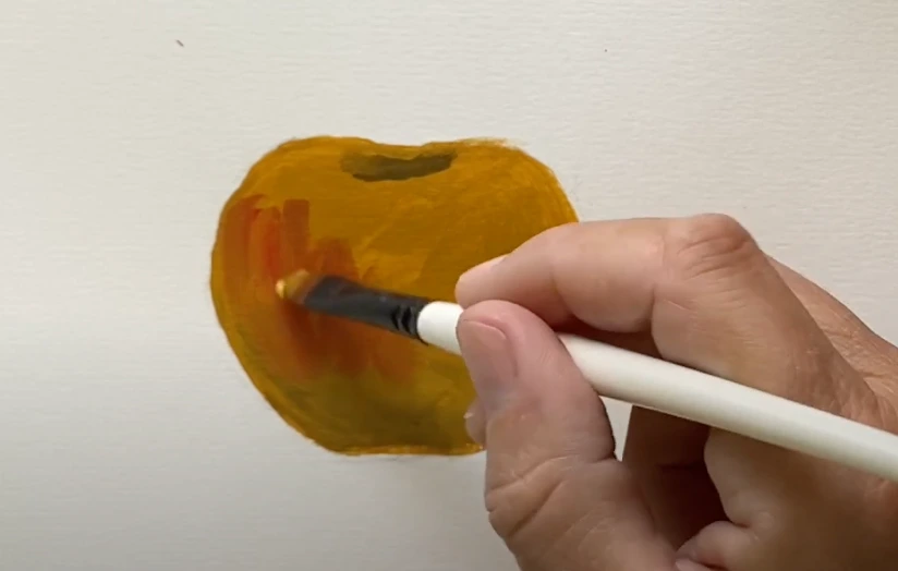 Kleuren mengen tijdens het schilderen van een appel