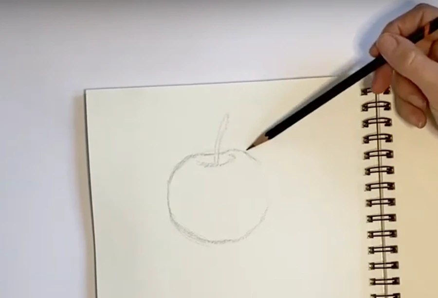 Schets van de vorm van een appel op papier